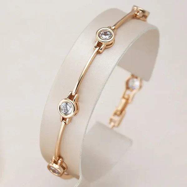1+1 Offer: Elegant Gold and Crystal Earrings + Elegant bracelet with zirconias in gold